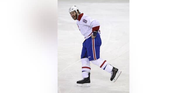 Montreal Canadiens' Brandon Prust yells after fighting during the first period of Game 3 of the NHL hockey Stanley Cup playoffs Eastern Conference finals against the New York Rangers, Thursday, May 22, 2014, in New York. The Canadiens defeated the Rangers in overtime, 3-2. (AP Photo/Seth Wenig)