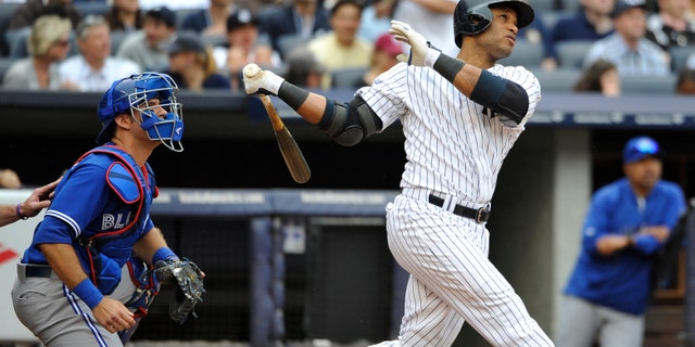 FILE - In this May 18, 2013 file photo, Toronto Blue Jays catcher J.P. Arencibia and New York Yankees Robinson Cano watch Cano's two-run home run off of starting pitcher Brandon Morrow in the fifth inning of a baseball game at Yankee Stadium in New York. On the first deadline day of the offseason, teams had until 5 p.m. to make $14.1 million qualifying offers to their eligible free agents, a group that includes Cano, Jacoby Ellsbury, Carlos Beltran and Shin-Soo Choo. (AP Photo/Kathy Kmonicek, File)