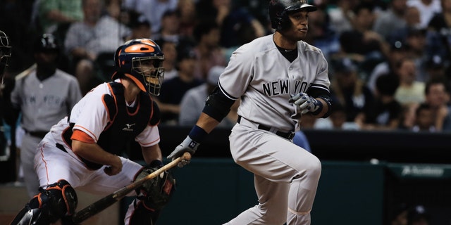HOUSTON, TX - SEPTEMBER 28: Robinson Cano #24 of the New York Yankees hits a single in the sixth inning against the Houston Astros at Minute Maid Park on September 28, 2013 in Houston, Texas. (Photo by Scott Halleran/Getty Images)
