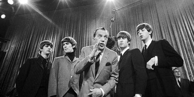 ** FOR USE AS DESIRED WITH BEATLES 45TH ANNIVERSARY ** In this Feb. 9, 1964 file photo, Ed Sullivan, center, stands with The Beatles during a rehearsal for the British group's first American appearance, on the