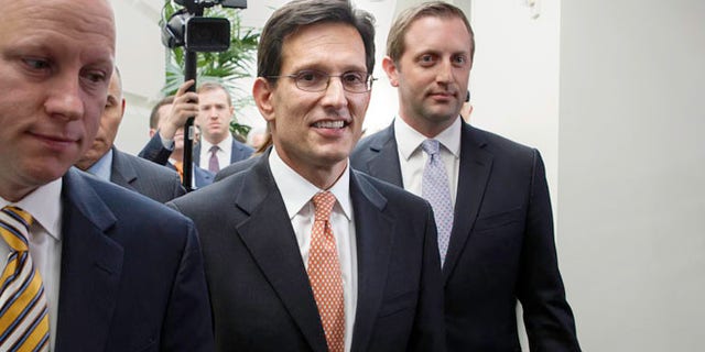 House Majority Leader Eric Cantor, R-Va., leaves a news conference after telling reporters he intends to resign his leadership post at the end of July following his defeat in the Virginia primary Tuesday, at the Capitol in Washington, Wednesday, June 11, 2014.