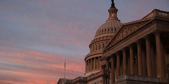 WASHINGTON, DC - SEPTEMBER 25: The sky changes color over the U.S. Capitol as the sun begins to rise September 25, 2013 in Washington, DC. Later today the U.S. Senate will vote on a stopgap spending bill that that passed the House last week. (Photo by Mark Wilson/Getty Images)