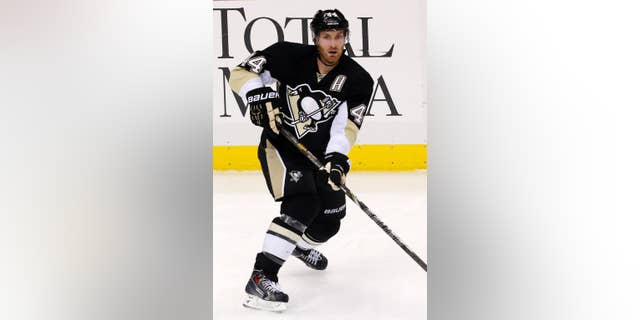 FILe - This is a Jan. 20, 2014 file photo showing Pittsburgh Penguins' Brooks Orpik (44) during an NHL hockey game against the Florida Panthers in Pittsburgh. The Washington Capitals opened free agency Tuesday , July 1, 2014, by signing defenseman Brooks Orpik to a $27.5 million, five-year contract, and goaltender Justin Peters to a $1.9 million, two-year contract. (AP Photo/Gene J. Puskar, File)