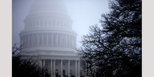 FILE - In this Dec. 10, 2012 file photo, fog obscures the Capitol dome on Capitol Hill in Washington.