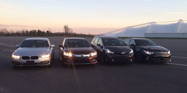 In this photo provided by the The Insurance Institute for Highway Safety, from left, a BMW 3 series, Honda Accord, Toyota Prius V and a Kia Optima are seen at the institutes Vehicle Research Center in Ruckersville, Va. A new study that rates the headlights of more than 30 midsized car models found only one model earned a good rating. Of the rest, half were rated acceptable and half were rated poor. The difference between the top-rated and bottom-rated model in terms of a drivers ability to see down a dark road was substantial. (Russ Rader/Insurance Institute for Highway Safety via AP)