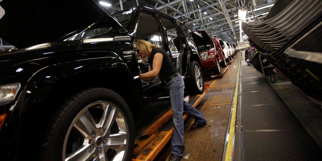 TOLEDO, OH - NOVEMBER 16:  Union worker Pam Bialecki installs carpet into a Jeep Liberty at the Toledo Assembly Complex on November 16, 2011 in Toledo, Ohio. Chrysler Group LLC says it will add 1,100 jobs at the Toledo, Ohio assembly complex along with a new body shop and quality center as part of an overall $1.7 billion investment to build a new generation of Jeep sport utility vehicles.  (Photo by J.D. Pooley/Getty Images)