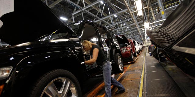 TOLEDO, OH - NOVEMBER 16: Union worker Pam Bialecki installs carpet into a Jeep Liberty at the Toledo Assembly Complex on November 16, 2011 in Toledo, Ohio. Chrysler Group LLC says it will add 1,100 jobs at the Toledo, Ohio assembly complex along with a new body shop and quality center as part of an overall $1.7 billion investment to build a new generation of Jeep sport utility vehicles. (Photo by J.D. Pooley/Getty Images)
