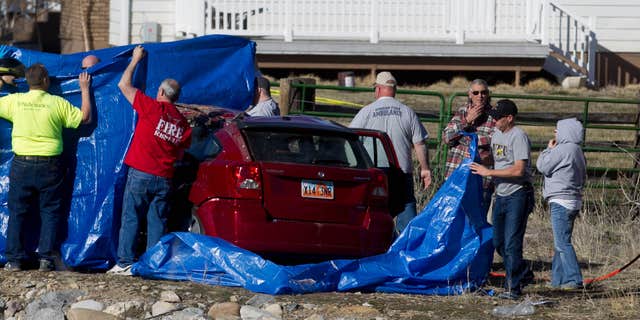 March 7, 2015: Officials respond to a report of car in the Spanish Fork River near the Main Street and the Arrowhead Trail Road junction in Spanish Fork, Utah.