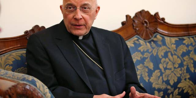 FILE - In this March 14, 2013 file photo, Cardinal Francis George speaks during an interview at the North American College in Rome. On Friday, March 7, 2014, the Archdiocese of Chicago announced that George is starting another round of chemotherapy to address signs of cancer returning to the area around his right kidney. He was diagnosed with cancer in August 2012 and had chemotherapy then. The diocese says the cancer was dormant for more than a year. (AP Photo/Michael Sohn, File)