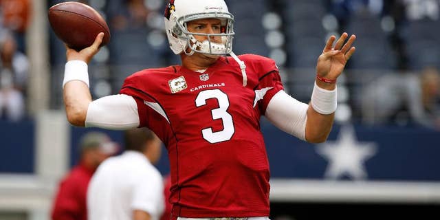 Arizona Cardinals quarterback Carson Palmer (3) warms up before an NFL football game against the Dallas Cowboys Sunday, Nov. 2, 2014, in Arlington, Texas. (AP Photo/Sue Ogrocki)