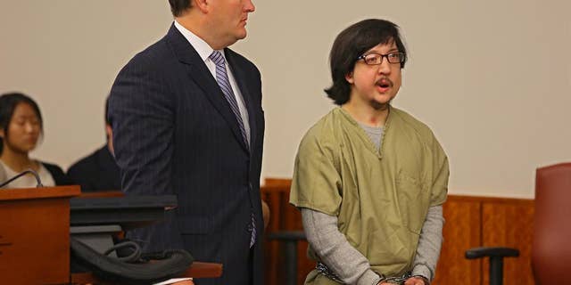 FILE - David Renz, right, 29, stands next to his defense attorney Ken Moynihan in Onondaga County Court in this July 17, 2013 file photo taken in Syracuse, N.Y. Federal authorities have decided against seeking the death penalty for the upstate New York man who cut off his electronic monitoring bracelet, then raped a 10-year-old girl and killed her mother last year, U.S. Attorney Richard Hartunian said Wednesday May 14, 2014. (AP Photo/The Syracuse Newspapers, Dick Blume, File)