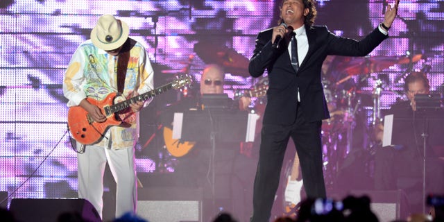 Carlos Santana and singer Carlos Vives during the 2013 Latin Recording Academy Person Of The Year honoring Miguel Bose at the Mandalay Bay Events Center on November 20, 2013 in Las Vegas, Nevada.