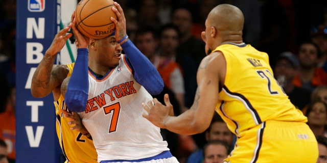 Indiana Pacers forward Paul George, left, and Pacers forward David West (21) in the second quarter of Game 1 of their second-round NBA basketball series at Madison Square Garden in New York, Sunday, May 5, 2013. (AP Photo/Kathy Willens)