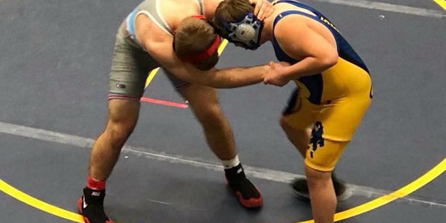 In less than a minute, Grant Fehlhafer pinned his competitor, senior Austin Middleton.