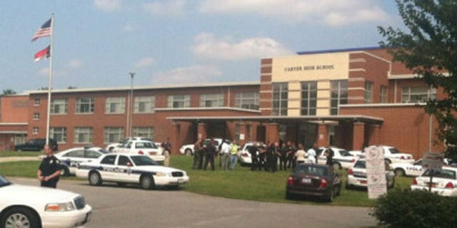Aug 30, 2013: The scene outside Carver High School after reports of shots fired.