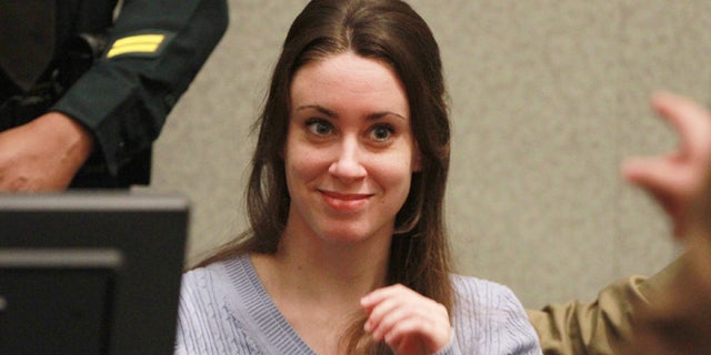 ORLANDO, FL - JULY 07: Casey Anthony smiles before the start of her sentencing hearing on charges of lying to a law enforcement officer at the Orange County Courthouse July 7, 2011 in Orlando, Florida. Anthony was acquitted of murder charges on July 5, 2011 but will serve four, one-year sentences on her conviction of lying to a law enforcement officer. She will be credited for the nearly three-years of time served and good behavior and will be released July 13. (Photo by Joe Burbank-Pool/Getty Images)