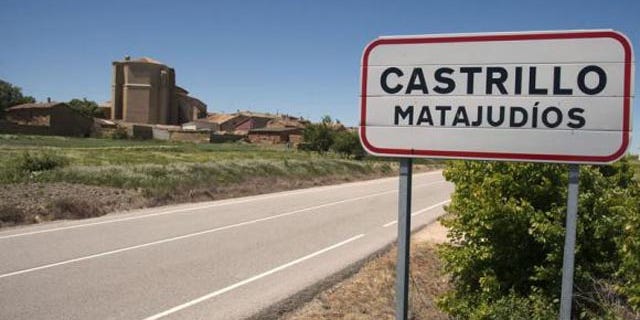 A sign welcomes visitors to Castrillo Matajudios, Spain (Reuters)