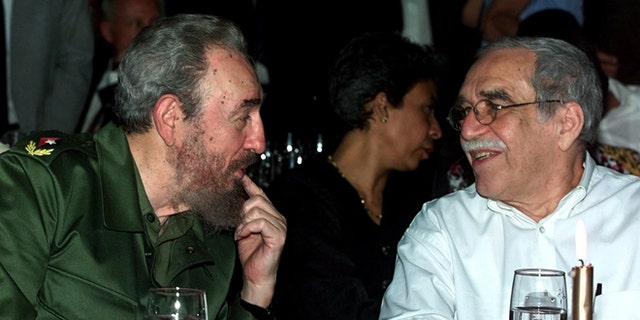 FILE - In this March 3, 2000 file photo, Cuba's leader Fidel Castro, left, and Colombian Nobel laureate Gabriel Garcia Marquez speak during a dinner at the annual cigar festival in Havana, Cuba. Marquez died on Thursday, April 17, 2014 at his home in Mexico City. (AP Photo/Jose Goitia, File)