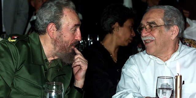 FILE - In this March 3, 2000 file photo, Cuba's leader Fidel Castro, left, and Colombian Nobel laureate Gabriel Garcia Marquez speak during a dinner at the annual cigar festival in Havana, Cuba. Marquez died on Thursday, April 17, 2014 at his home in Mexico City. (AP Photo/Jose Goitia, File)