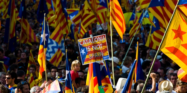 BARCELONA, SPAIN - SEPTEMBER 11: People hold Pro-independence Catalan flags in a demonstration calling for independence during the Catalonia's National Day on September 11, 2012 in Barcelona, Spain. Thousands of Catalans took to the streets of Barcelona demanding a split from Spain and control of their own economy under the slogan 'Catalonia: New European State' on Catalonia's National Day. The Diada Nacional is held every September 11 to remember the defeat of the Catalan troops in 1714. (Photo by David Ramos/Getty Images)