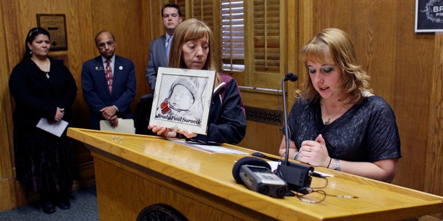 In this Monday, Jan. 28, 2013 photo, Heather Surovik, who lost her 8 1/2-month-old unborn son when her car was struck by drunken driver Gary Sheats in 2012, speaks at a news conference promoting a political drive to grant "personhood" status to unborn fetuses at the Colorado State Capitol in Denver.(AP Photo/Brennan Linsley)
