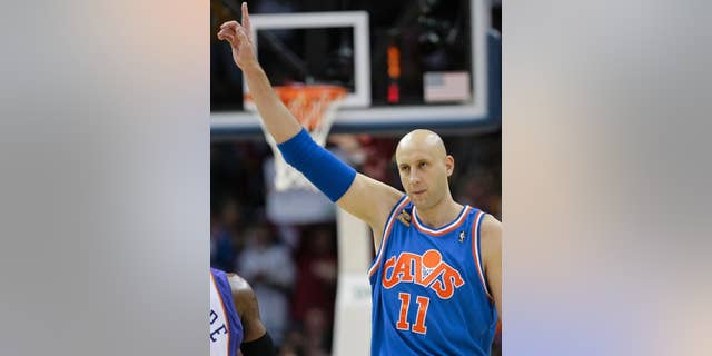 FILE - In this Dec. 2, 2009, file photo, Cleveland Cavaliers' Zydrunas Ilgauskas, of Lithuania, acknowledges the crowd while entering an NBA basketball game against the Phoenix Suns in Cleveland. Ilgauskas, a gentle giant who connected with Cleveland fans and became one of the city's most beloved athletes, will have his No. 11 jersey retired during halftime ceremonies Saturday, March 8, 2014, by the Cavaliers. (AP Photo/Tony Dejak, File)