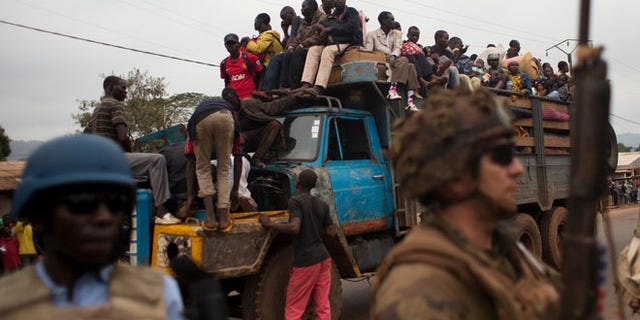 Dec. 27, 2013: In this file photo, French soldiers protect a truck of fleeing Muslims after it broke down and was surrounded by hundreds of hostile Christian residents, including several anti-balaka militiamen, in the Gobongo neighborhood of Bangui, Central African Republic.