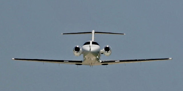 ** ADVANCE FOR WEEKEND EDITIONS, JUNE 25-26 ** A Cessna Citation Mustang business jet takes off for a test flight while a larger business jet comes in for a landing in the distance, June 15, 2005, in Wichita, Kan. Cessna has more than 200 orders for the entry-level business jet .  (AP Photo/Charlie Riedel)