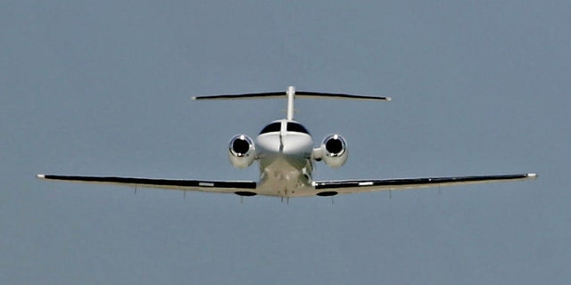 ** ADVANCE FOR WEEKEND EDITIONS, JUNE 25-26 ** A Cessna Citation Mustang business jet takes off for a test flight while a larger business jet comes in for a landing in the distance, June 15, 2005, in Wichita, Kan. Cessna has more than 200 orders for the entry-level business jet . (AP Photo/Charlie Riedel)