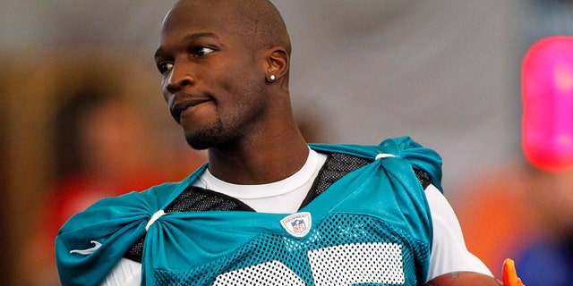 July 29, 2012: In this file photo, Miami Dolphins' Chad Johnson practices during NFL football training camp in Davie, Fla.