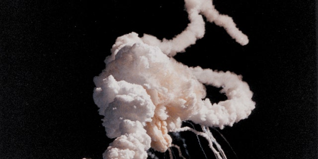 Jan. 28, 1986: The Space Shuttle Challenger and her seven-member crew were lost when a ruptured O-ring in the right solid rocket booster caused an explosion soon after launch. This photograph, taken a few seconds after the accident, shows the main engines and solid rocket booster exhaust plumes entwined around a ball of gas from the external tank.
