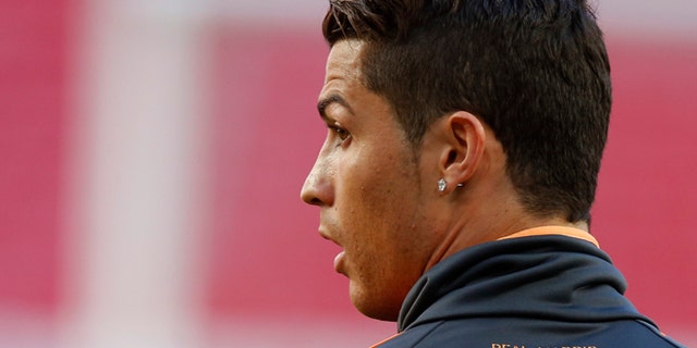 Real's Cristiano Ronaldo looks on, during a training session ahead of Saturday's Champions League final soccer match between Real Madrid and Atletico Madrid, in Luz stadium in Lisbon, Portugal, Friday, May 23, 2014. (AP Photo/Daniel Ochoa de Olza)