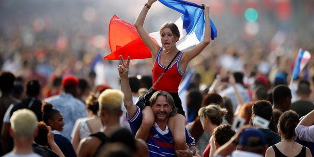 People celebrating on the Champs-Elysees in Paris after France won the World Cup on Sunday.