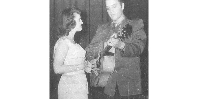 Wanda Jackson admiring Elvis Presley.