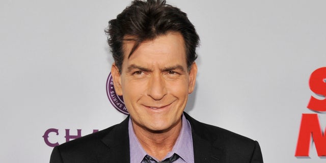 In this April 11, 2013, file photo, Charlie Sheen, a cast member in "Scary Movie V," poses at the Los Angeles premiere of the film at the Cinerama Dome in Los Angeles.