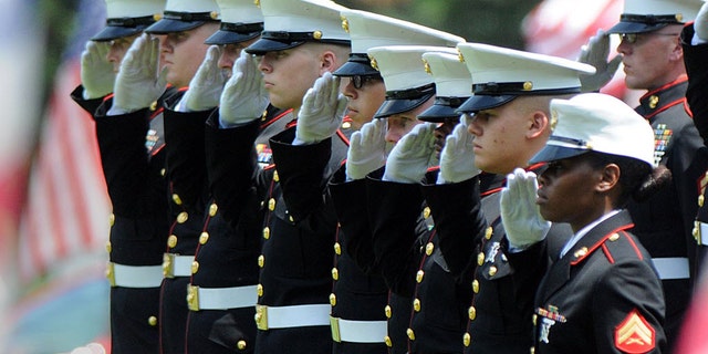 Marines give a final salute to Marine Gunnery Sgt. Thomas Sullivan during ceremony at the Massachusetts Veterans' Memorial Cemetery, Monday, July 27, 2015, in Agawam, Mass. Sullivan was one of five service members killed by a gunman in Chattanooga, Tenn. on July 16. The gunman was killed by police. (Don Tregger/The Republican via AP, Pool)