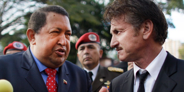 Venezuela's President Hugo Chavez, left, talks to actor Sean Penn, of United States, who visited the presidential palace in Caracas, Venezuela, Thursday, Feb. 16, 2012. (AP Photo/Ariana Cubillos)