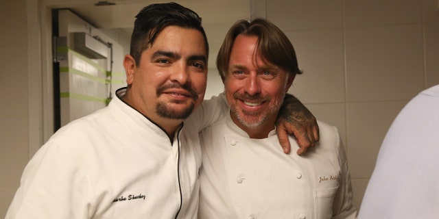 NEW YORK, NY - OCTOBER 16: Chefs Aaron Sanchez (L) and John Besh pose at the Johnny Sanchez Dinner hosted by John Besh, Aaron Sanchez and Katy Sparks as a part of the Bank of America Dinner Series during the Food Network New York City Wine & Food Festival Presented By FOOD & WINE at Tavern On The Green on October 16, 2014 in New York City. (Photo by Mireya Acierto/Getty Images for NYCWFF)