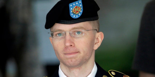 FILE -  In this June 5, 2013, file photo Army Pvt. Chelsea Manning, then-Army Pfc. Bradley Manning, is escorted out of a courthouse in Fort Meade, Md., after the third day of his court martial. (AP Photo/Patrick Semansky, File)