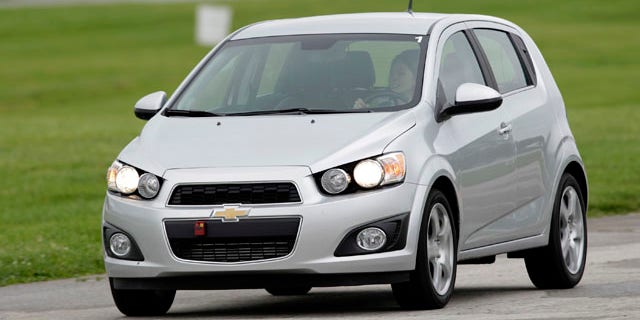 A 2012 Chevrolet Sonic hatchback is driven around the track during a media engineering drive in Indianapolis, Indiana May 27, 2011. REUTERS/AJ Mast/Chevrolet/Handout (UNITED STATES - Tags: TRANSPORT BUSINESS) FOR EDITORIAL USE ONLY. NOT FOR SALE FOR MARKETING OR ADVERTISING CAMPAIGNS. THIS IMAGE HAS BEEN SUPPLIED BY A THIRD PARTY. IT IS DISTRIBUTED, EXACTLY AS RECEIVED BY REUTERS, AS A SERVICE TO CLIENTS