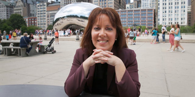 In this photo taken Thursday, June 30, 2016, Friends of the Parks Director Juanita Irizarry poses for a portrait in Chicago's Millennium Park after an interview with the Associated in Chicago. Irizarry heads the obscure nonprofit that stood its ground and blocked Star Wars creator George Lucas' private museum from being built on Chicago's prized lakefront. (AP Photo/Charles Rex Arbogast)