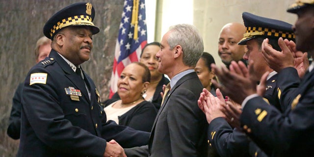 Chicago Mayor Rahm Emanuel shakes hands with Eddie Johnson on Wednesday, April 13, 2016, in Chicago.