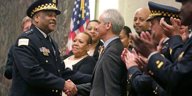 Chicago Mayor Rahm Emanuel shakes hands with Eddie Johnson on Wednesday, April 13, 2016, in Chicago.