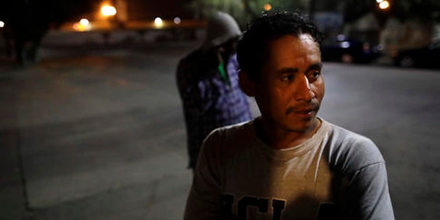 Guatamalan Elvin Vazquez looks on from a street in front of a shelter for migrants after being deported Monday, Nov. 14, 2016, in Tijuana, Mexico. Vazquez spent more than 13 years in the United States before being deported. In an interview with CBS' "60 Minutes" broadcast Sunday night, President-elect Donald Trump said he would focus on deporting people with criminal records beyond their immigration status. (AP Photo/Gregory Bull)
