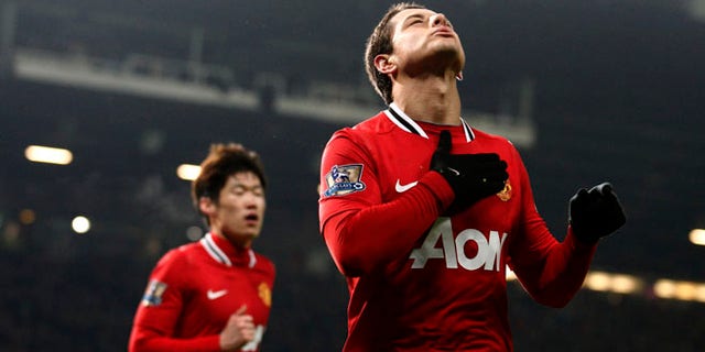 Manchester United's Javier Hernandez celebrates after scoring against Stoke, Jan. 31, 2012. (AP Photo/Jon Super)