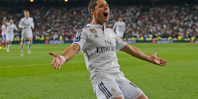 Real Madrid's Chicharito celebrates scoring his side's first goal during the second leg quarterfinal Champions League soccer match between Real Madrid and Atletico Madrid at Santiago Bernabeu stadium in Madrid, Spain, Wednesday April 22, 2015. Real won the match with a 1-0 score and advances to the semifinal. (AP Photo/Paul White)