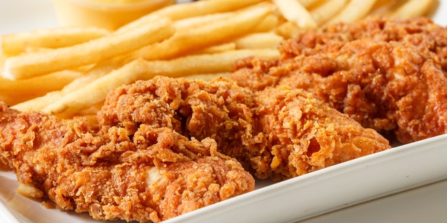 A woman was caught on camera dipping her chicken finger in soda.