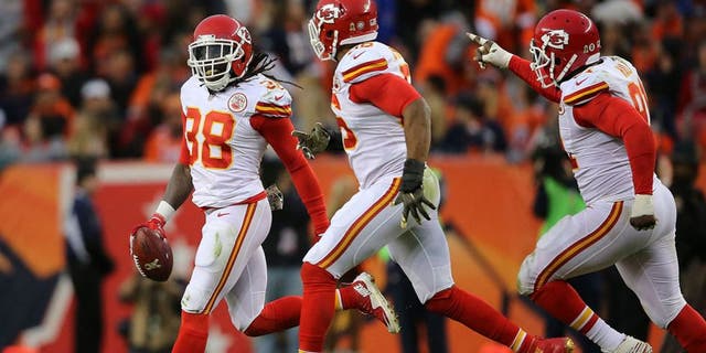 DENVER, CO - NOVEMBER 15: Ron Parker #38 of the Kansas City Chiefs celebrates his interception of a pass by Peyton Manning #18 of the Denver Broncos with Derrick Johnson #56 and Tamba Hali #91 of the Kansas City Chiefs at Sports Authority Field at Mile High on November 15, 2015 in Denver, Colorado. The Chiefs defeated the Broncos 29-13. (Photo by Doug Pensinger/Getty Images)