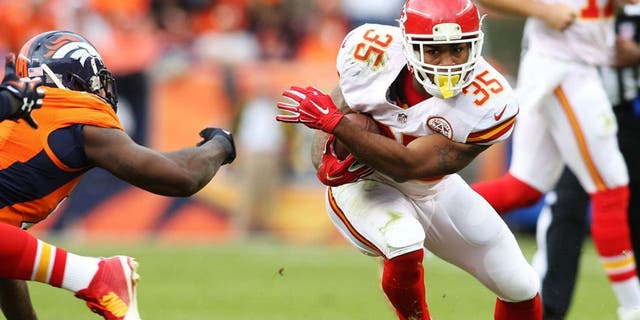 Nov 15, 2015; Denver, CO, USA; Kansas City Chiefs running back Charcandrick West (35) runs the ball during the first half against the Denver Broncos at Sports Authority Field at Mile High. Mandatory Credit: Chris Humphreys-USA TODAY Sports