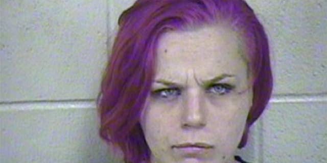 This photo made available by the Jackson County Detention Center on Saturday, Sept. 12, 2015 shows Brittany Mugrauer. The 24-year-old mother is in custody after her dirty, barefoot 4- and 6-year-old children were found living in a wooden shipping crate in an underground cave on the eastern edge of Kansas City, Mo. Mugrauer was charged Friday with two counts of felony child endangerment. (Jackson County Detention Center via AP)